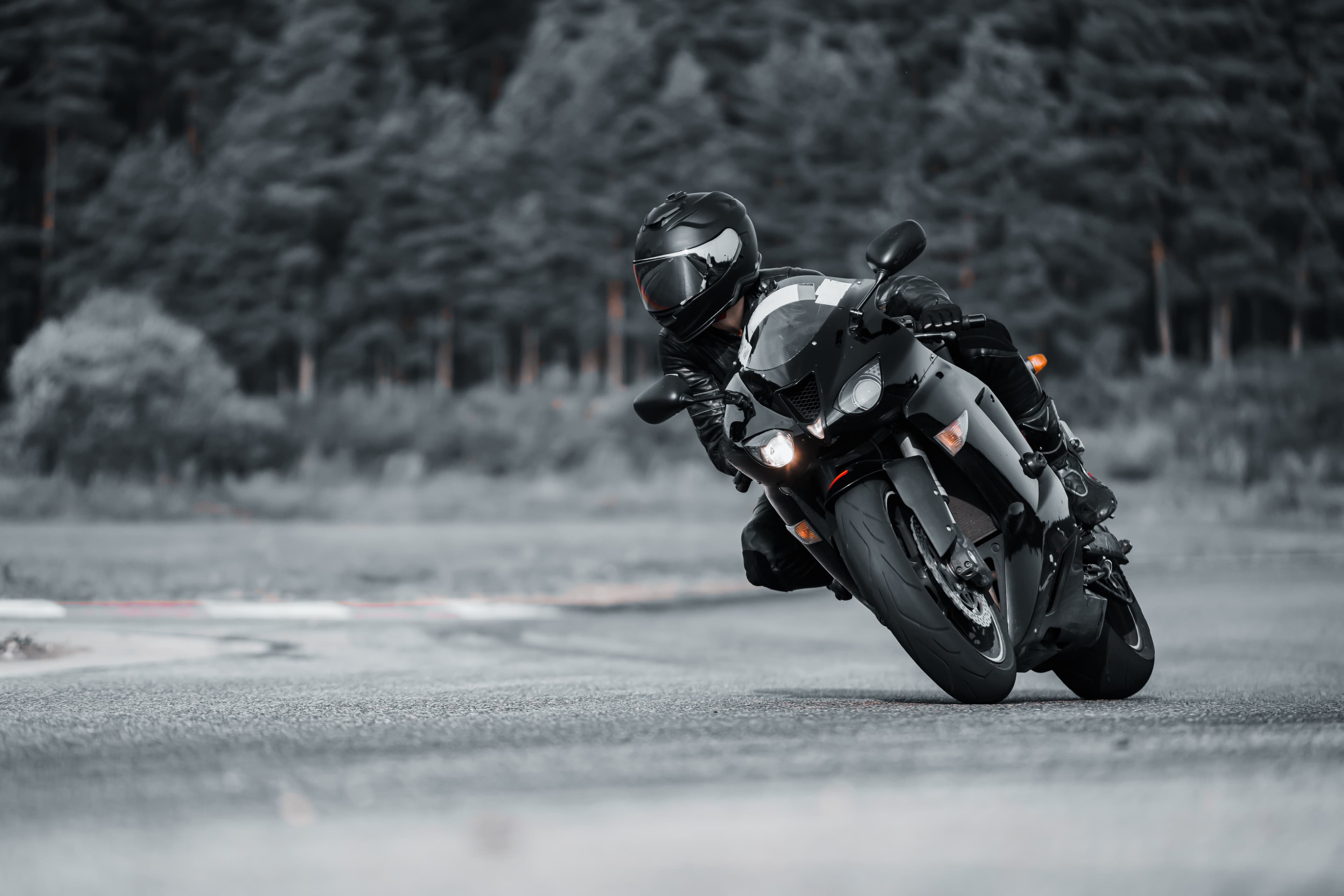 Motorbike taking a corner on a race track