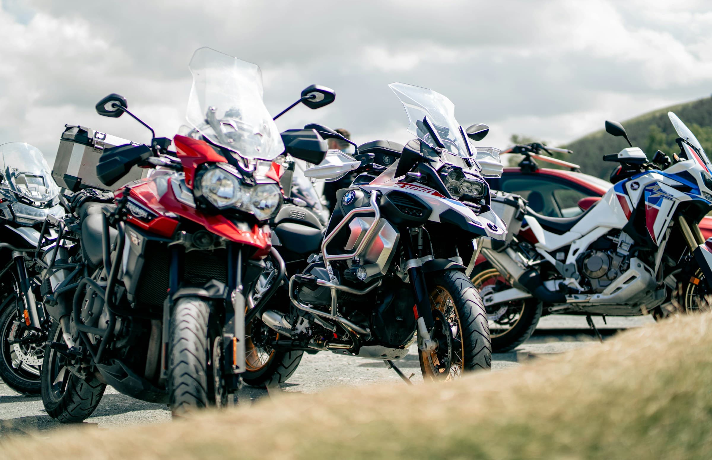 Motorbikes parked on the side of a road